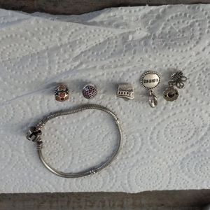 Used Pandora bracelet with cute charms.  Mint condition !
